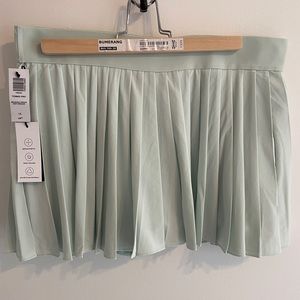 Aritzia TNA Tennis Pro Skirt NWT brushed green size L
